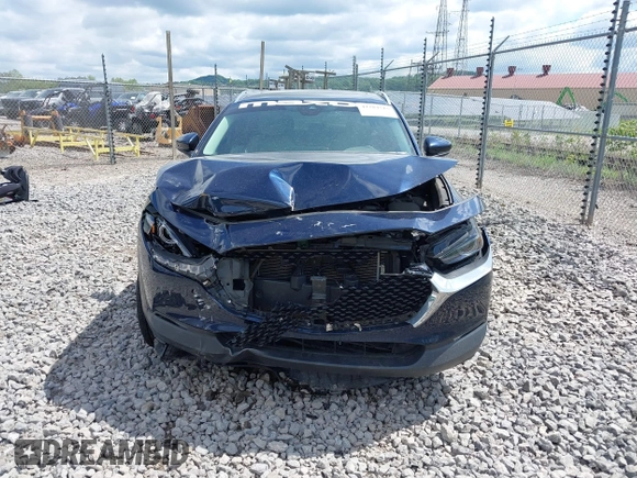 2021 Mazda CX-30 Premium z VIN 3MVDMBDL7MM236474, wystawiony jako IAAI lot #42284515 z przebiegiem 58 565 mil mil oraz . Historia ofert i sprzedaży dostępna na DreamBid. Obrazek 12.
