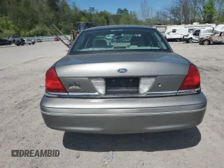 2004 Ford Crown Victoria LX z VIN 2FAFP74W14X130606, wystawiony jako Copart lot #54120085 z przebiegiem 221 700 mil mil oraz Szkody całkowita. Historia ofert i sprzedaży dostępna na DreamBid. Obrazek 6.
