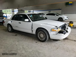 2003 Ford Crown Victoria LX with VIN 2FAFP74W23X134274, listed as a Copart auction lot 73295754 with 212,581 mi miles and Salvage Title. Bid and sale history available at carsss.com. Image 4.