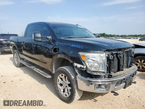 2016 Nissan Titan Platinum Reserve with VIN 1N6BA1F42GN506140, listed as a Copart auction lot 57171395 with 141,295 mi miles and Salvage title. Bid and sale history available at DreamBid. Image 4.