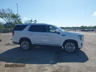 2023 GMC Yukon Denali with VIN 1GKS1DKL2PR303909, listed as a IAAI auction lot 42018679 with 65,532 mi miles. Bid and sale history available at carsss.com. Image 13.