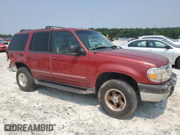 2000 Ford Explorer XLT with VIN 1FMZU73E4YZA72348, listed as a Copart auction lot 59015585 with 182,606 mi miles and Salvage title. Bid and sale history available at DreamBid. Image 4.