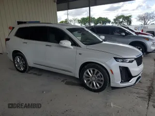 2023 Cadillac XT6 FWD Premium Luxury with VIN 1GYKPCRS4PZ103819, listed as a Copart auction lot 76279704 with 19,601 mi miles and Clean Title. Bid and sale history available at carsss.com. Image 4.