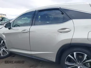 2021 Lexus RX 450h with VIN 2T2HGMDA0MC067228, listed as a IAAI auction lot 41818836 with 28,850 mi miles and . Bid and sale history available at DreamBid. Image 14.