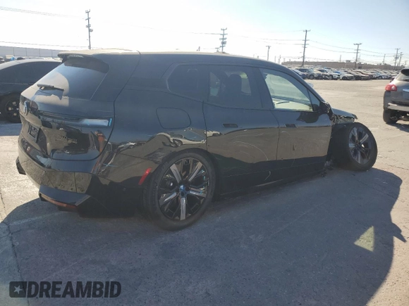 2024 BMW iX M60 with VIN WB533CF01RCR28341, listed as a Copart auction lot 69646904 with 1,753 mi miles and Salvage Title. Bid and sale history available at carsss.com. Image 3.