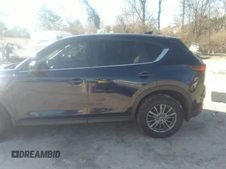 2020 Mazda CX-5 Touring with VIN JM3KFACM1L1817303, listed as a IAAI auction lot 41627859 with 57,268 mi miles. Bid and sale history available at carsss.com. Image 14.