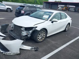 2019 Toyota Camry LE with VIN 4T1B11HK2KU743445, listed as a IAAI auction lot 42129688 with 284,938 mi miles and . Bid and sale history available at DreamBid. Image 17.