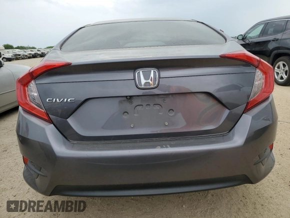 2017 Honda Civic LX z VIN 19XFC2F53HE043251, wystawiony jako Copart lot #53965175 z przebiegiem 91 156 mil mil oraz Czysty tytuł • Clean title. Historia ofert i sprzedaży dostępna na DreamBid. Obrazek 6.
