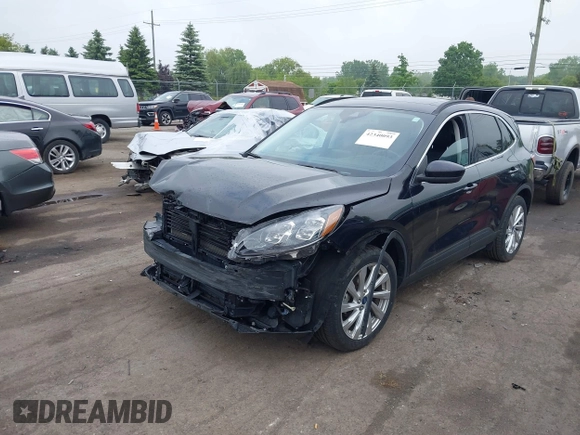 2021 Ford Escape Titanium Hybrid with VIN 1FMCU9DZ5MUA18079, listed as a IAAI auction lot 42340093 with 71,630 mi miles and . Bid and sale history available at DreamBid. Image 2.