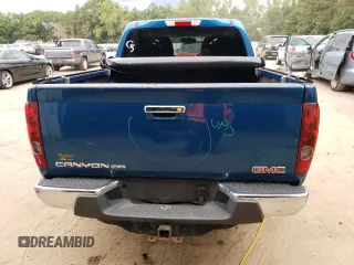 2011 GMC Canyon SLE1 with VIN 1GTH6MFE3B8119385, listed as a Copart auction lot 70492994 with 105,305 mi miles and Salvage Title. Bid and sale history available at carsss.com. Image 6.