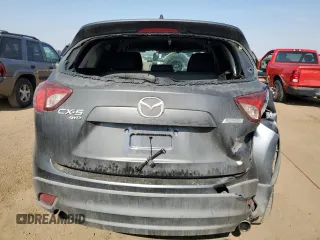 2014 Mazda CX-5 Sport z VIN JM3KE4BE1E0359446, wystawiony jako Copart lot #54562545 z przebiegiem 128 150 mil mil oraz Szkoda całkowita • Salvage title. Historia ofert i sprzedaży dostępna na DreamBid. Obrazek 6.