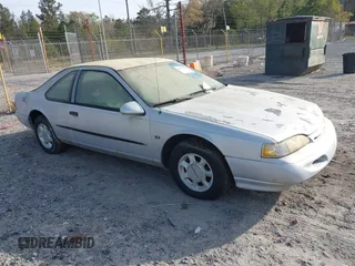 1995 Ford Thunderbird LX with VIN 1FALP62WXSH147871, listed as a IAAI auction lot 41878652 with 95,305 mi miles. Bid and sale history available at carsss.com. Image 1.