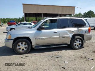 2004 GMC Envoy SLT with VIN 1GKDS13S942193519, listed as a Copart auction lot 84952984 with 156,599 mi miles and Salvage Title. Bid and sale history available at carsss.com. Image 1.