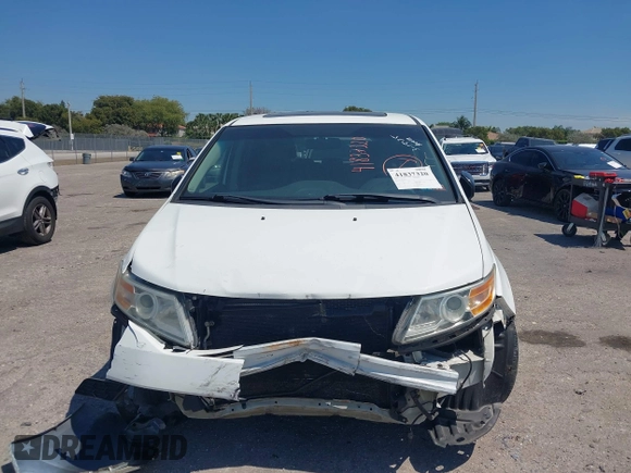 2012 Honda Odyssey EX-L with VIN 5FNRL5H61CB019215, listed as a IAAI auction lot 41837320 with 248,498 mi miles and . Bid and sale history available at DreamBid. Image 13.