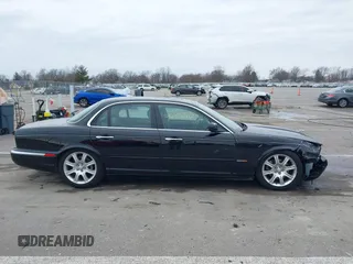 2004 Jaguar XJ with VIN SAJWA71C14SG20122, listed as a IAAI auction lot 41685767 with 113,392 mi miles. Bid and sale history available at carsss.com. Image 14.