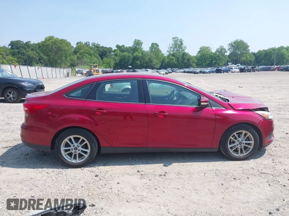 2017 Ford Focus SE z VIN 1FADP3F26HL305624, wystawiony jako IAAI lot #42411111 z przebiegiem 58 865 mil mil oraz . Historia ofert i sprzedaży dostępna na DreamBid. Obrazek 13.
