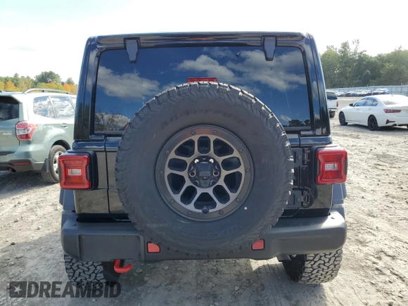2023 Jeep Wrangler Rubicon with VIN 1C4HJXFN4PW636133, listed as a Copart auction lot 75499614 with 13,252 mi miles and Salvage title. Bid and sale history available at DreamBid. Image 6.