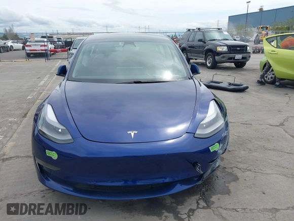 2021 Tesla Model 3 Long Range with VIN 5YJ3E1EB6MF878411, listed as a IAAI auction lot 41986947 with 71,978 mi miles and . Bid and sale history available at DreamBid. Image 13.