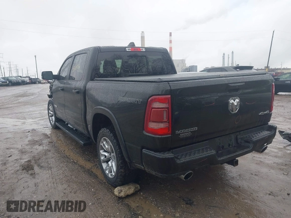 2021 Ram 1500 Laramie with VIN 1C6SRFJT6MN580803, listed as a IAAI auction lot 41207914 with 56,891 mi miles and . Bid and sale history available at DreamBid. Image 3.