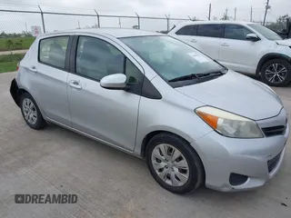2013 Toyota Yaris L with VIN JTDKTUD32DD542761, listed as a IAAI auction lot 41969533 with 123,281 mi miles. Bid and sale history available at carsss.com. Image 1.