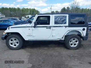 2015 Jeep Wrangler Unlimited Sahara with VIN 1C4HJWEG6FL556460, listed as a IAAI auction lot 42066648 with 54,747 mi miles. Bid and sale history available at carsss.com. Image 15.