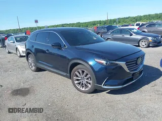 2023 Mazda CX-9 Grand Touring with VIN JM3TCBDY9P0633470, listed as a IAAI auction lot 42301295 with 33,931 mi miles and . Bid and sale history available at DreamBid. Image 1.