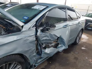2014 Ford Fusion SE Hybrid with VIN 3FA6P0LU8ER283409, listed as a IAAI auction lot 40984629 with 206,605 mi miles. Bid and sale history available at carsss.com. Image 6.