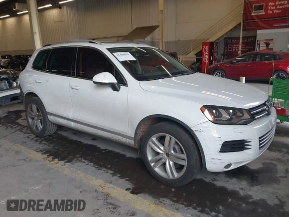 2013 Volkswagen Touareg Lux with VIN WVGEF9BP6DD007323, listed as a IAAI auction lot 41488959 with 123,383 mi miles and . Bid and sale history available at DreamBid. Image 1.