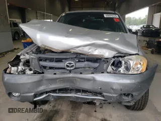 2001 Mazda Tribute LX with VIN 4F2CU08141KM65160, listed as a Copart auction lot 60895624 with 255,194 mi miles and Salvage Title. Bid and sale history available at carsss.com. Image 5.
