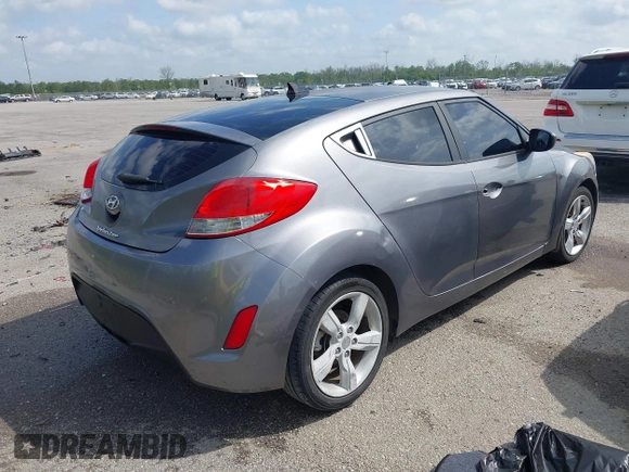 2013 Hyundai Veloster w/Black Int with VIN KMHTC6AD6DU169765, listed as a IAAI auction lot 41928516 with 130,708 mi miles and . Bid and sale history available at DreamBid. Image 4.