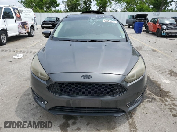 2015 Ford Focus Titanium z VIN 1FADP3N2XFL357224, wystawiony jako Copart lot #55626575 z przebiegiem 159 422 mil mil oraz Szkoda całkowita • Salvage title. Historia ofert i sprzedaży dostępna na DreamBid. Obrazek 5.