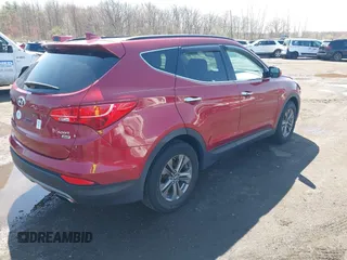 2014 Hyundai Santa Fe z VIN 5XYZUDLB3EG226857, wystawiony jako IAAI lot #41917762 z przebiegiem 42 677 mil mil oraz . Historia ofert i sprzedaży dostępna na DreamBid. Obrazek 4.