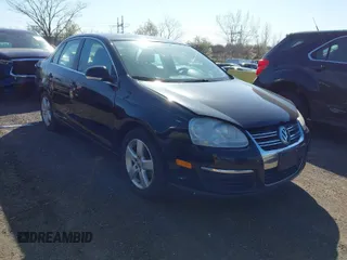 2009 Volkswagen Jetta Sedan SE with VIN 3VWRZ71K29M125398, listed as a IAAI auction lot 42002406 with 143,482 mi miles. Bid and sale history available at carsss.com. Image 1.