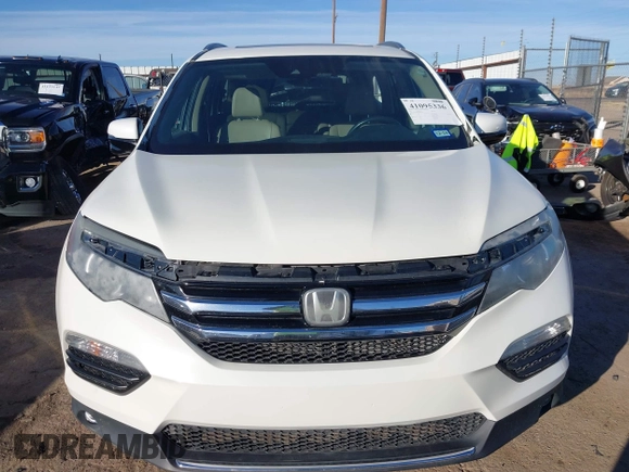 2017 Honda Pilot Touring with VIN 5FNYF6H93HB056387, listed as a IAAI auction lot 41095336 with 90,376 mi miles and . Bid and sale history available at DreamBid. Image 12.