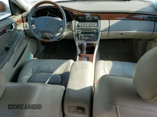 2003 Cadillac DeVille DTS z VIN 1G6KF57933U147843, wystawiony jako Copart lot #55875195 z przebiegiem 160 814 mil mil oraz Szkody całkowita. Historia ofert i sprzedaży dostępna na DreamBid. Obrazek 8.