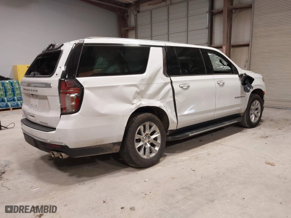 2023 Chevrolet Suburban Premier with VIN 1GNSCFKD8PR299995, listed as a IAAI auction lot 41607729 with 64,549 mi miles. Bid and sale history available at carsss.com. Image 4.