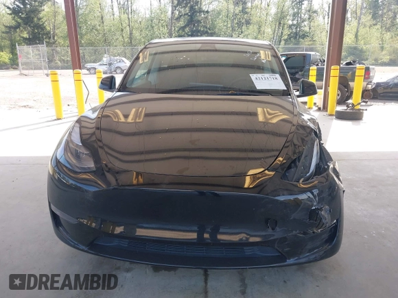 2022 Tesla Model Y Long Range with VIN 7SAYGDEE1NF550202, listed as a IAAI auction lot 42121718 with 28,211 mi miles and . Bid and sale history available at carsss.com. Image 12.