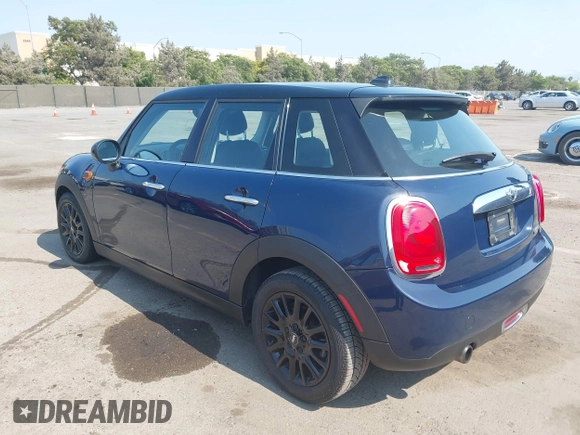 2015 MINI Hardtop 4 Door with VIN WMWXS5C50FT830060, listed as a IAAI auction lot 42744826 with 99,813 mi miles and . Bid and sale history available at DreamBid. Image 3.