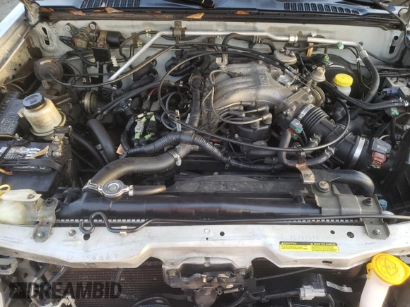 2000 Nissan Frontier XE with VIN 1N6ED26T8YC349616, listed as a Copart auction lot 85468524 with 207,578 mi miles and Salvage title. Bid and sale history available at DreamBid. Image 12.
