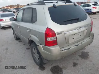 2007 Hyundai Tucson SE with VIN KM8JN12D77U539841, listed as a IAAI auction lot 41777599 with 126,958 mi miles. Bid and sale history available at carsss.com. Image 3.