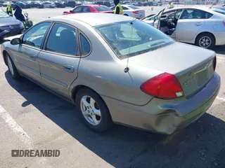 2002 Ford Taurus SE Standard with VIN 1FAFP53U02A215964, listed as a IAAI auction lot 42063534 with 187,424 mi miles and . Bid and sale history available at DreamBid. Image 3.