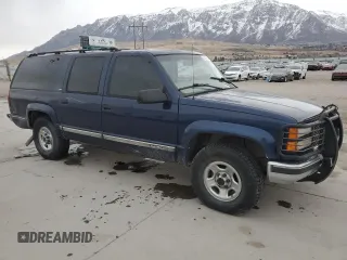 1999 GMC Suburban with VIN 1GDFK16R9XJ771458, listed as a Copart auction lot 43412175 with 159,328 mi miles and Salvage Title. Bid and sale history available at carsss.com. Image 4.