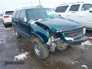 1998 GMC Jimmy SL with VIN 1GKCS13W4W2562613, listed as a IAAI auction lot 41610601 with 1 mi miles. Bid and sale history available at carsss.com. Image 1.