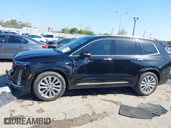 2020 Cadillac XT6 FWD Premium Luxury z VIN 1GYKPERS0LZ232338, wystawiony jako IAAI lot #41845562 z przebiegiem 86 839 mil mil oraz . Historia ofert i sprzedaży dostępna na DreamBid. Obrazek 14.