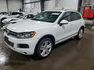 2014 Volkswagen Touareg Sport with VIN WVGEF9BP0ED011983, listed as a Copart auction lot 54477415 with 152,869 mi miles and Salvage title. Bid and sale history available at DreamBid. Image 1.