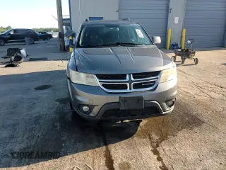 2013 Dodge Journey SXT with VIN 3C4PDCBG0DT522408, listed as a Copart auction lot 62699195 with 130,665 mi miles and Salvage title. Bid and sale history available at DreamBid. Image 14.