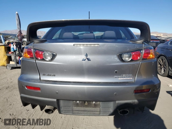 2015 Mitsubishi Lancer Evolution Final Edition z VIN JA32W7FV0FU027962, wystawiony jako Copart lot #85763774 z przebiegiem 56 671 mil mil oraz Szkoda całkowita • Salvage title. Historia ofert i sprzedaży dostępna na DreamBid. Obrazek 6.