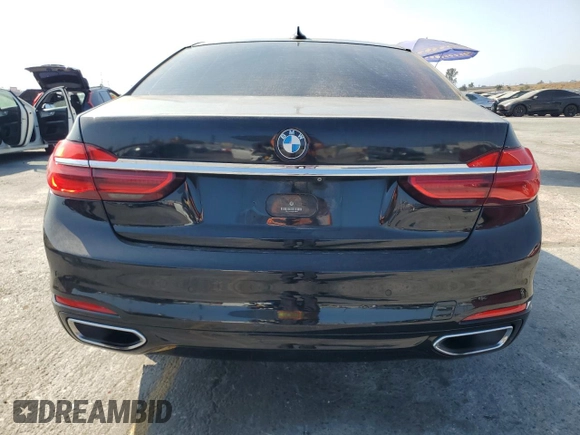 2017 BMW 7 Series 740i with VIN WBA7E2C50HG739565, listed as a Copart auction lot 64584885 with 114,496 mi miles and Salvage title. Bid and sale history available at DreamBid. Image 6.