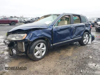 2012 Volkswagen Touareg Lux z VIN WVGEK9BP1CD009751, wystawiony jako IAAI lot #41240224 z przebiegiem Nie podano mil oraz . Historia ofert i sprzedaży dostępna na DreamBid. Obrazek 2.