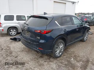 2023 Mazda CX-5 Signature with VIN JM3KFBXY5P0251046, listed as a IAAI auction lot 41505815 with 37,594 mi miles and . Bid and sale history available at carsss.com. Image 4.